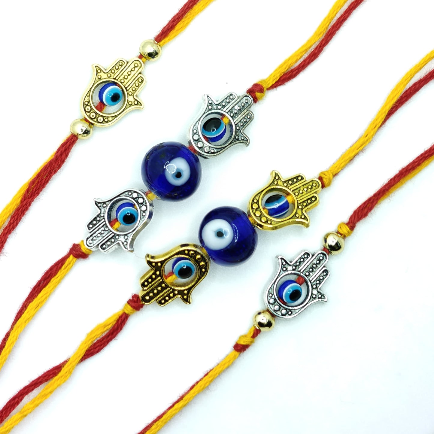 Set of colorful bracelets with eye-shaped charms on a white background