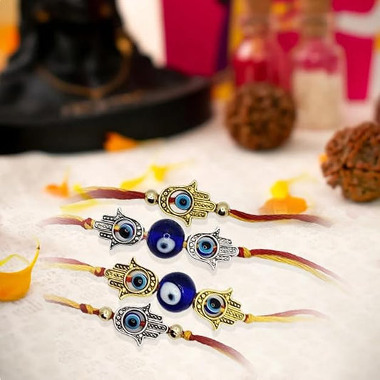 Set of decorative bracelets with eye designs on a textured surface.